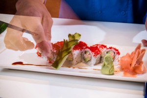 A Chef Preparing a Sushi Roll