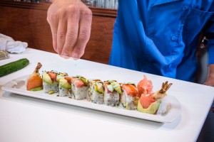 A Chef Preparing a Sushi Roll